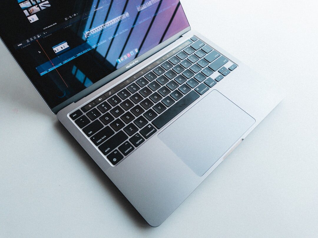 Modern laptop on a clean desk with technology interface